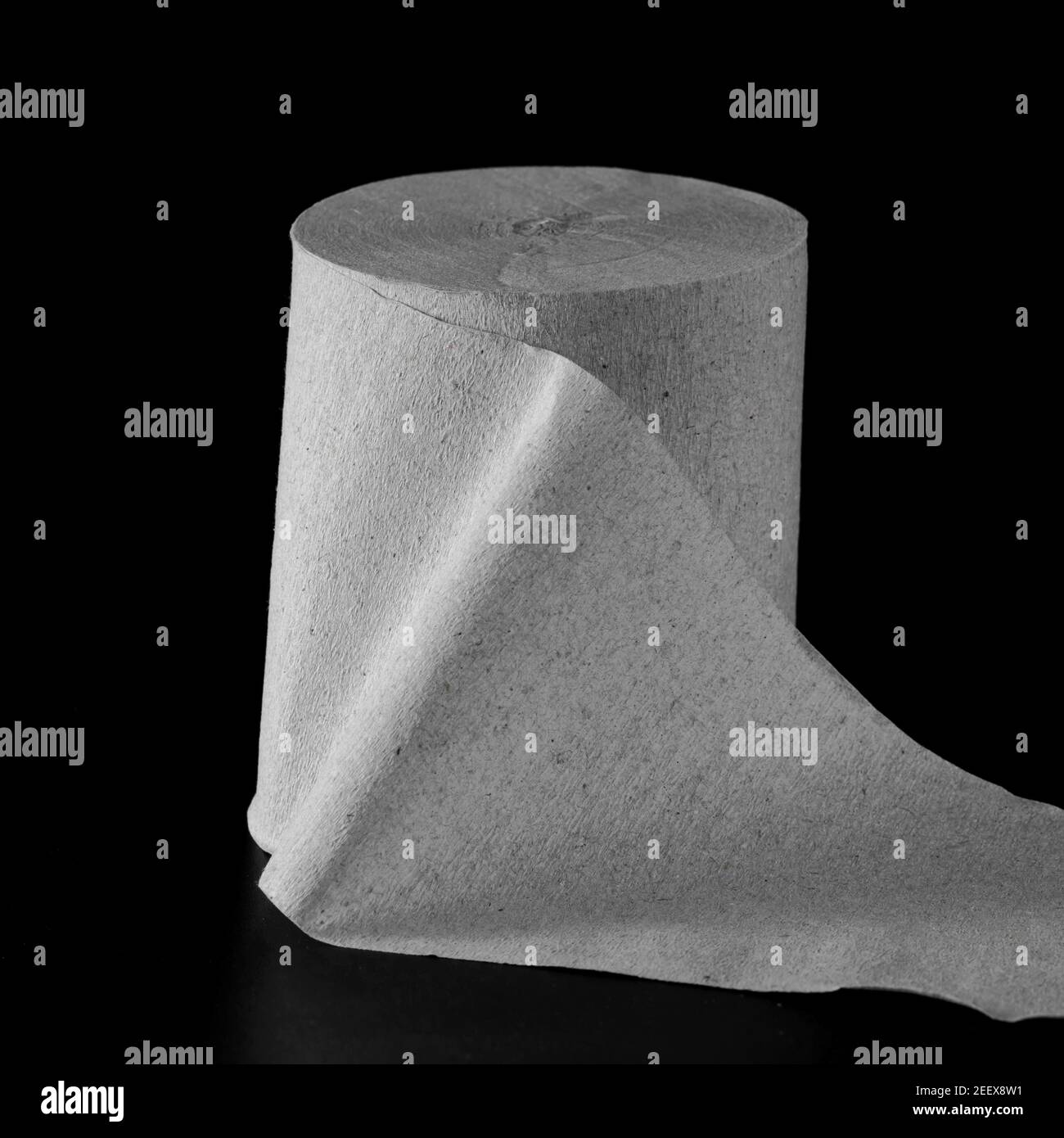 Roll of toilet paper on black background isolated Stock Photo Alamy