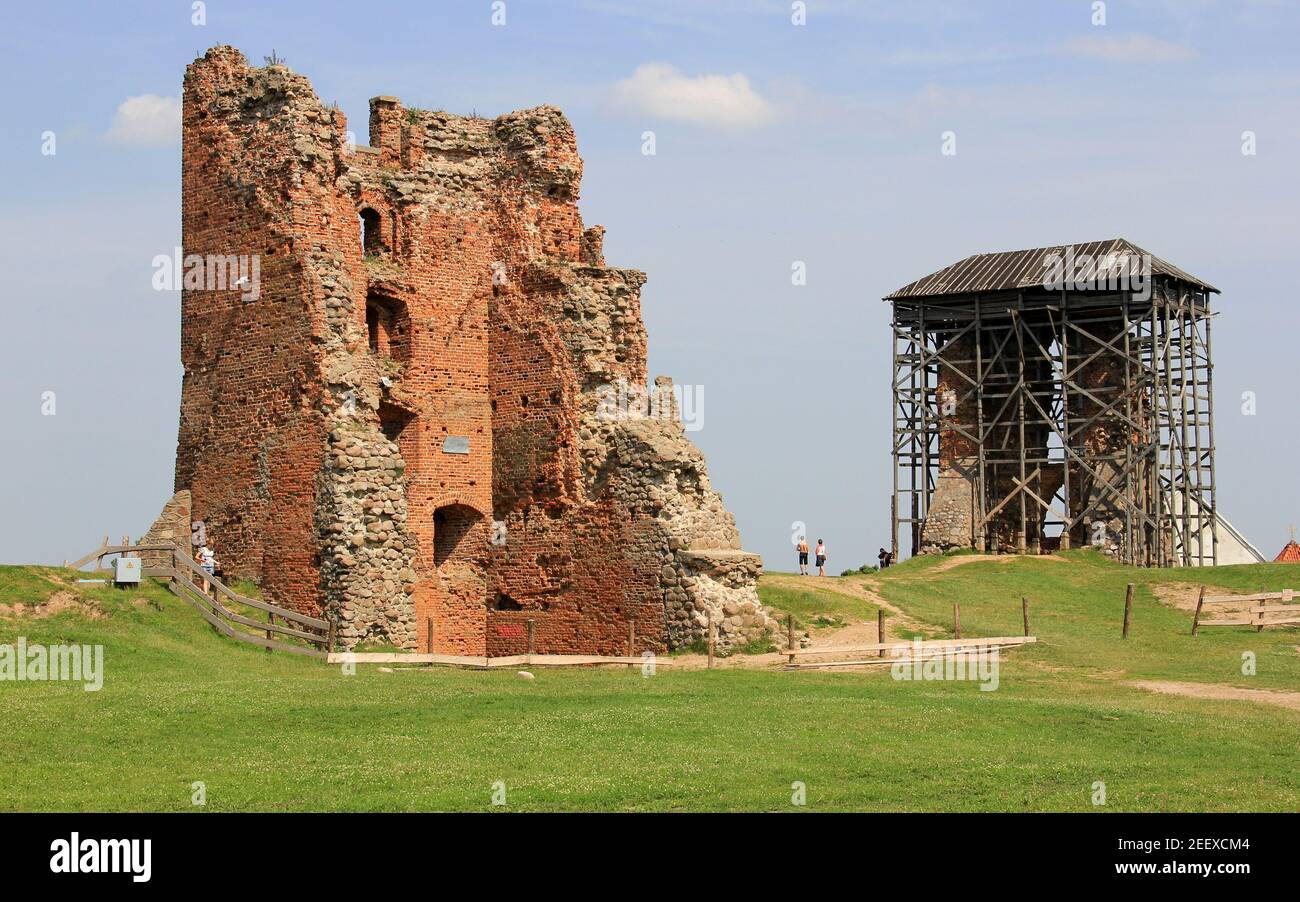 Ruins of the medieval castle, view of the remains of walls and tower on top of the castle hill, Navahrudak, Belarus Stock Photo