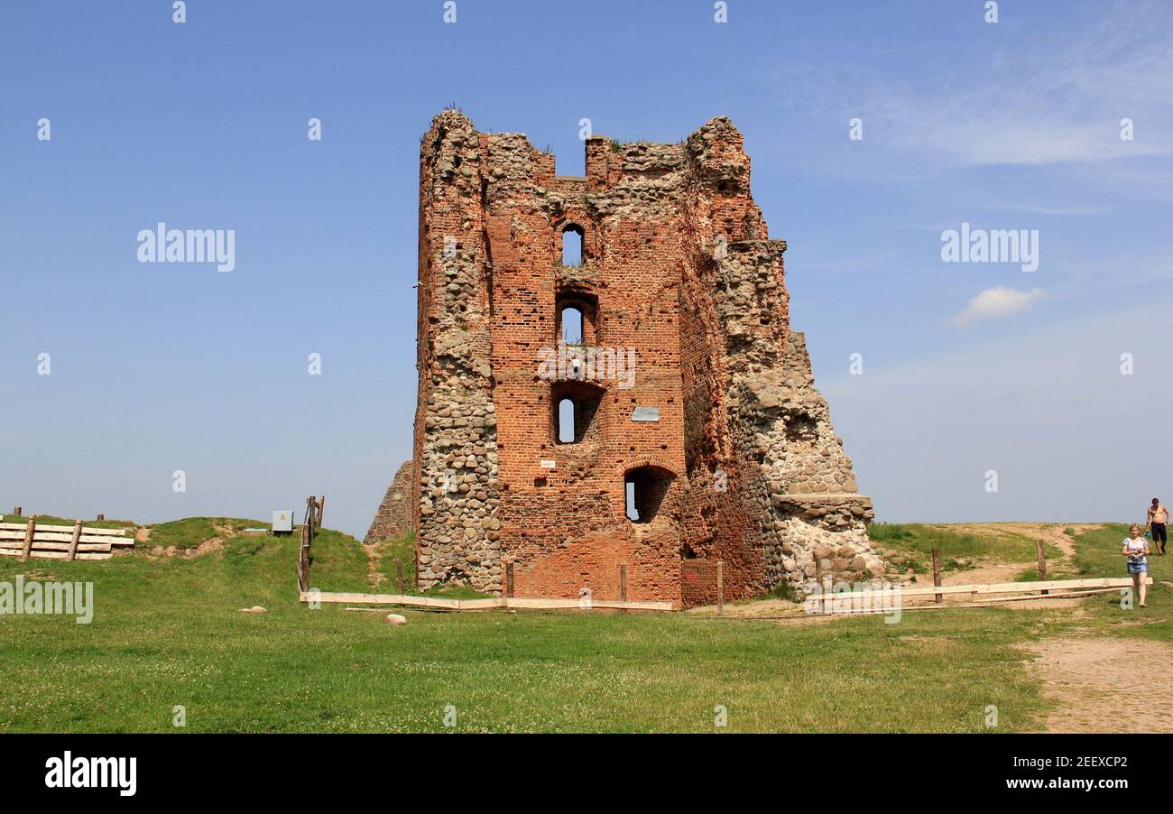 Ruins of the medieval castle, view of the remains of walls and tower on top of the castle hill, Navahrudak, Belarus Stock Photo
