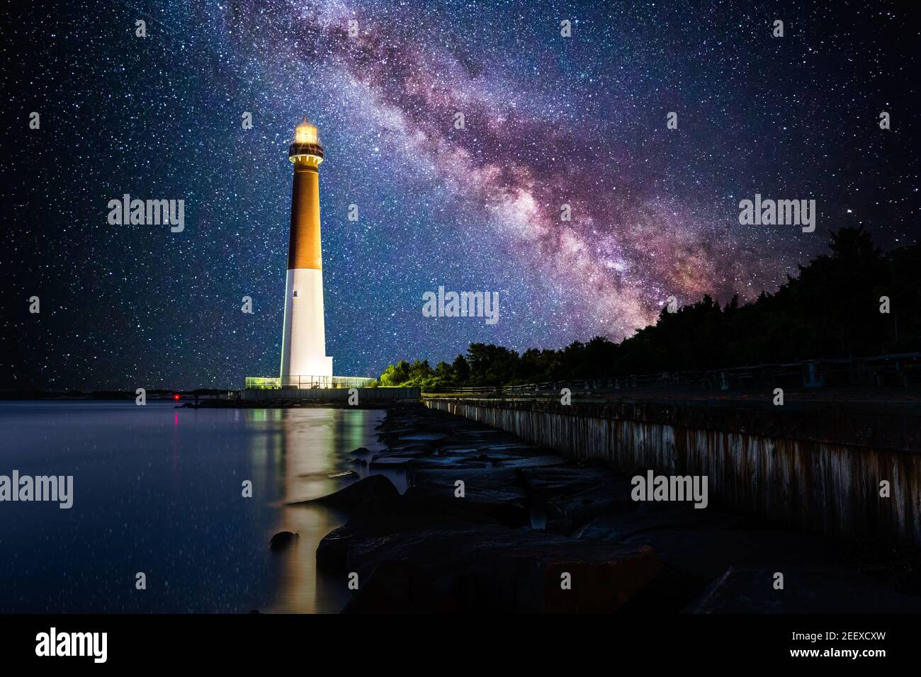 Barnegat Lighthouse under a starry night Stock Photo