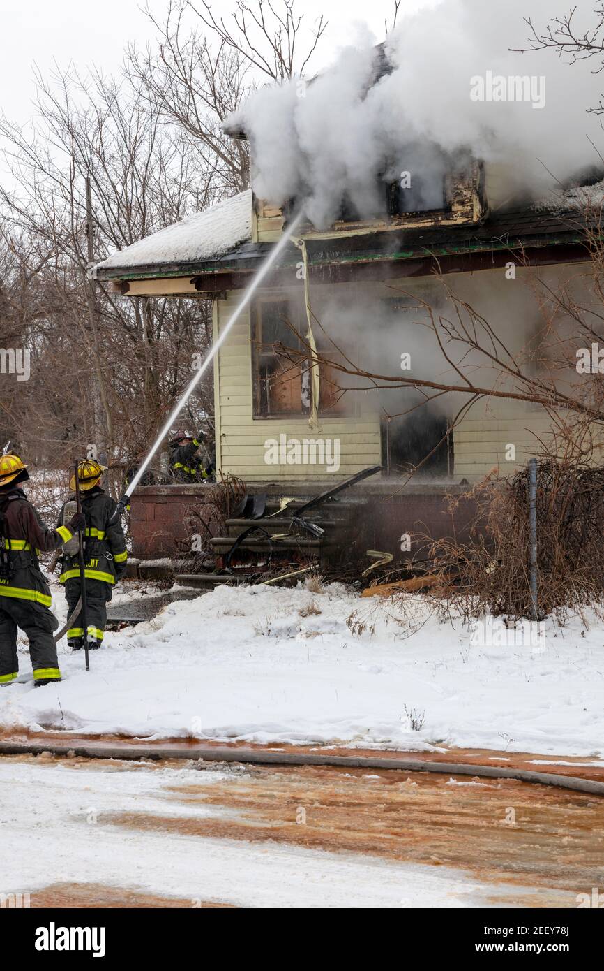Detroit firefighters extinguishing vacant dwelling fire, Box Alarm, Detroit, MI, USA, by James D Coppinger/Dembinsky Photo Assoc Stock Photo