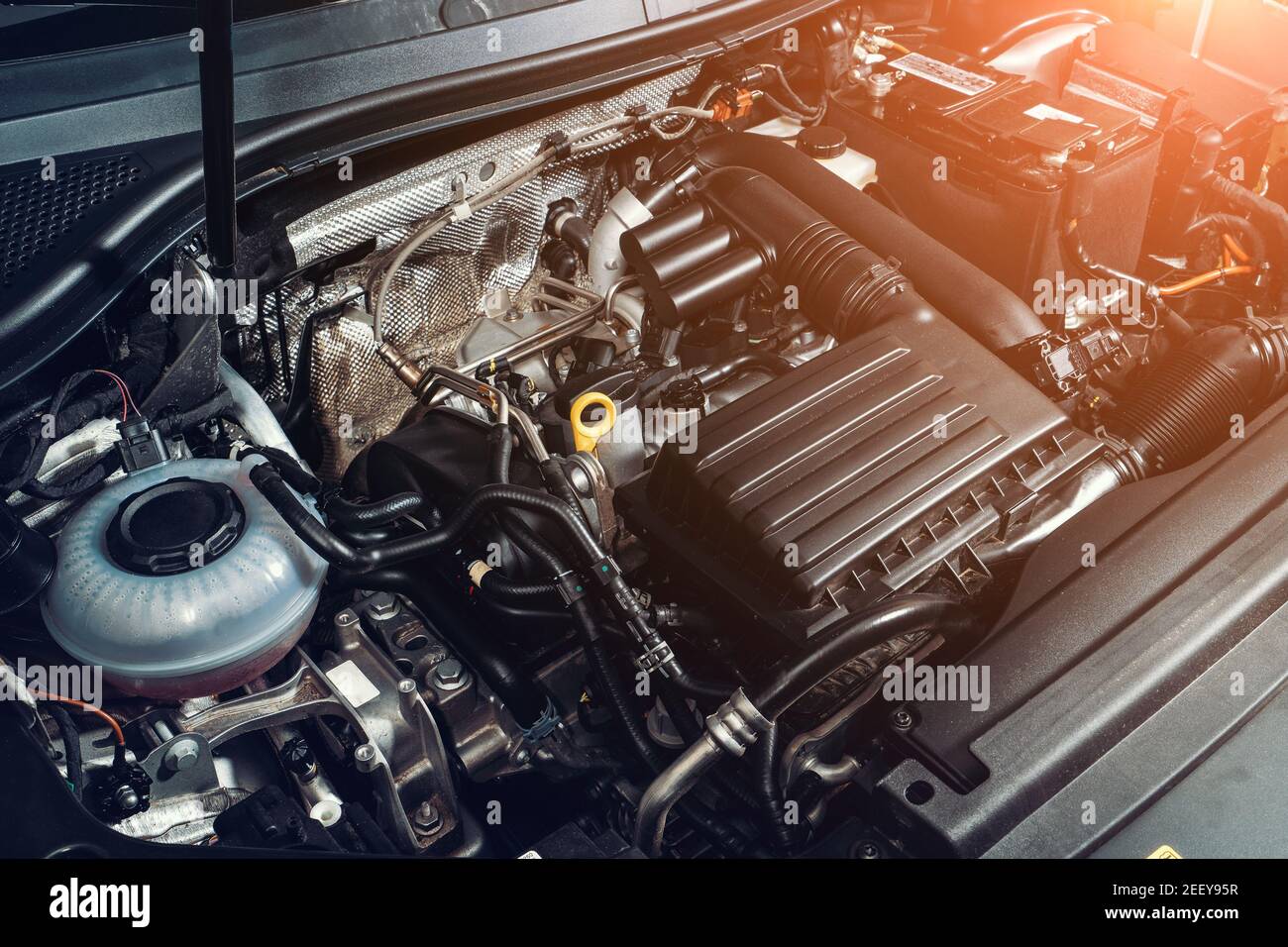 View under car hood at modern turbocharged eco-friendly engine or motor close up. Stock Photo