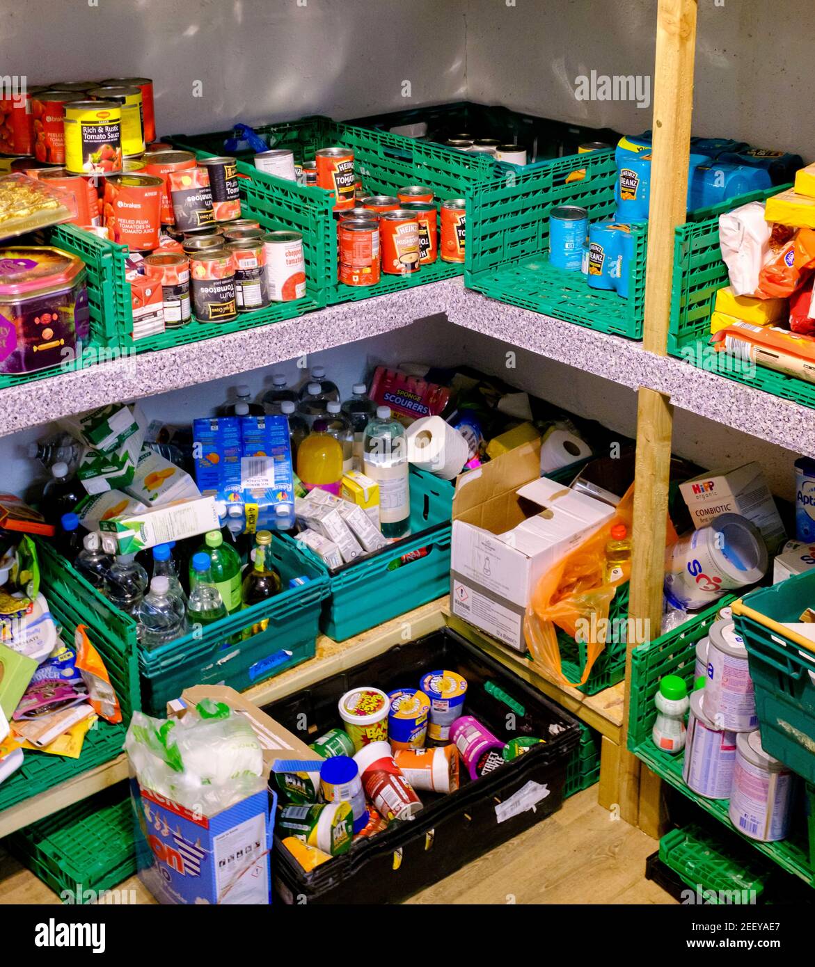 A food pantry used as a stock cupboard for tinned and dried goods at a Trussell Trust foodbank, London, UK. Food donations for people in food poverty. Stock Photo