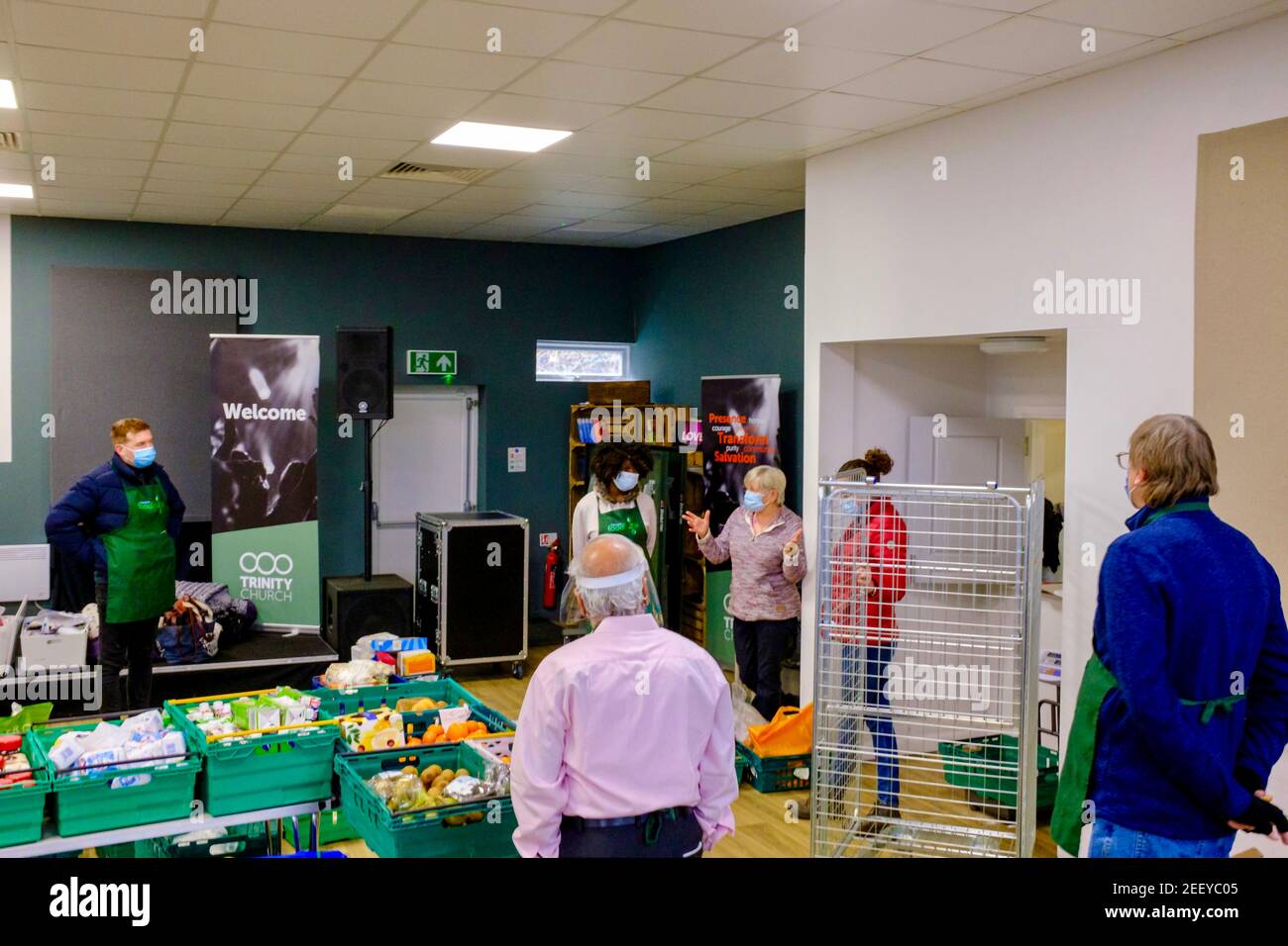 Volunteers at a Trussell Trust foodbank volunteering to collect, sort and organise donated food to be given out to the local community in Colindale UK Stock Photo