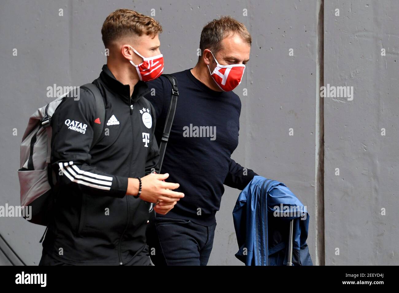 Soccer Football - Bundesliga - Bayern Munich v SC Freiburg - Allianz Arena, Munich, Germany - June 20, 2020 Bayern Munich's Joshua Kimmich and interim coach Hansi Flick wearing protective face masks before the match, following the resumption of play behind closed doors after the outbreak of the coronavirus disease (COVID-19)  Sven Hoppe/Pool via REUTERS  DFL regulations prohibit any use of photographs as image sequences and/or quasi-video Stock Photo