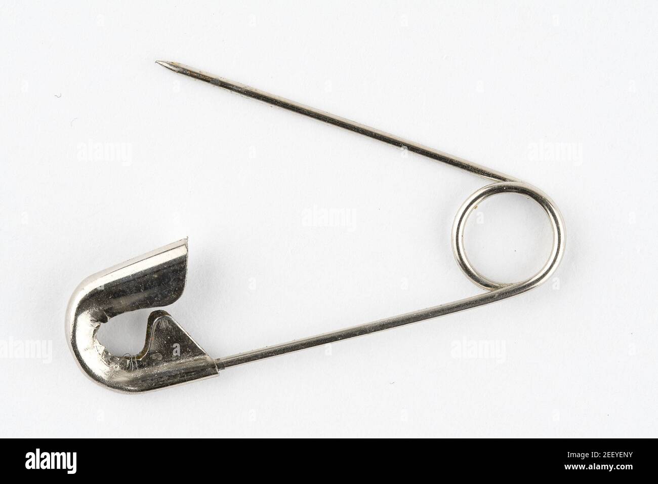 Macro image of a single open safety pin Stock Photo Alamy