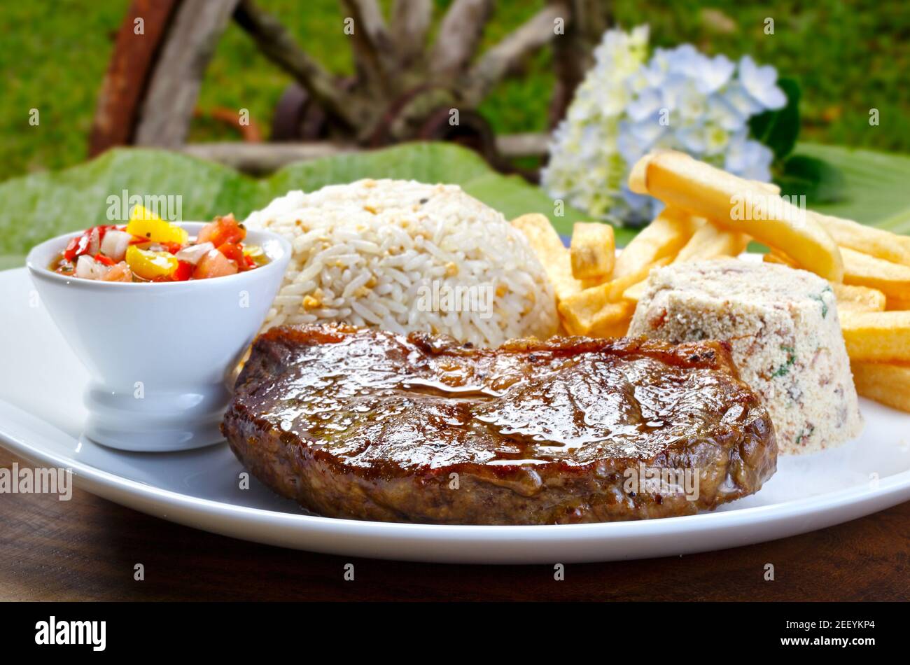 Grilled meat with trimmings Stock Photo Alamy