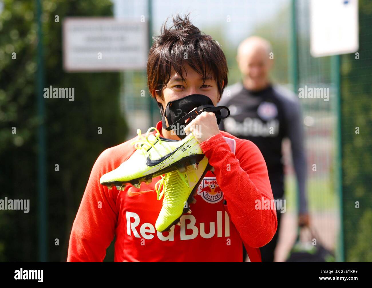 Soccer Football - Red Bull Salzburg Training - Red Bull Trainingszentrum, Salzburg, Austria - April 21, 2020 Red Bull Salzburg's Masaya Okugawa wearing a protective face mask after training despite most sport being cancelled around the world as the spread of coronavirus disease (COVID19) continues. REUTERS/Leonhard Foeger Stock Photo