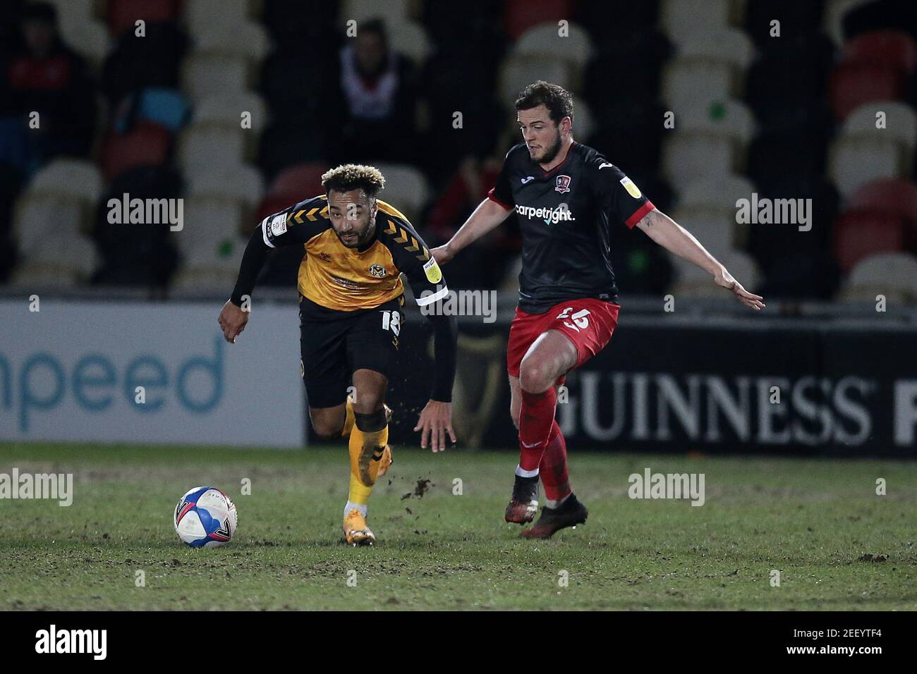 Newport, UK. 16th Feb, 2021. Nicky Maynard of Newport County and Pierce Sweeney of Exeter City during the EFL Sky Bet League 2 match between Newport County and Exeter City at Rodney Parade, Newport, Wales on 16 February 2021. Photo by Dave Peters. Editorial use only, license required for commercial use. No use in betting, games or a single club/league/player publications. Credit: UK Sports Pics Ltd/Alamy Live News Stock Photo