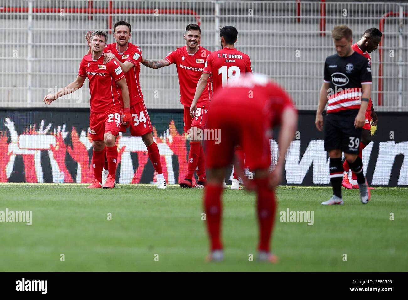 Soccer Football - Bundesliga - 1. FC Union Berlin v Fortuna Dusseldorf - Stadion An der Alten Forsterei, Berlin, Germany - June 27, 2020 Union's Suleiman Abdullahi celebrates scoring their third goal with teammates, following the resumption of play behind closed doors after the outbreak of the coronavirus disease (COVID-19)  Maja Hitij/Pool via REUTERS  DFL regulations prohibit any use of photographs as image sequences and/or quasi-video Stock Photo