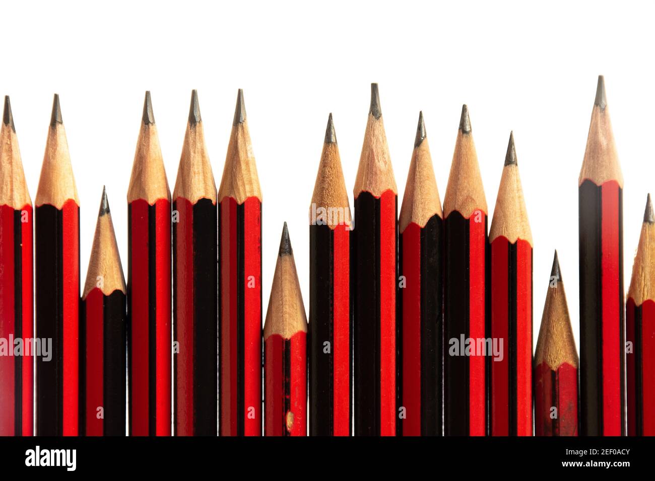 Close up of an uneven line of black and red lead pencils Stock Photo