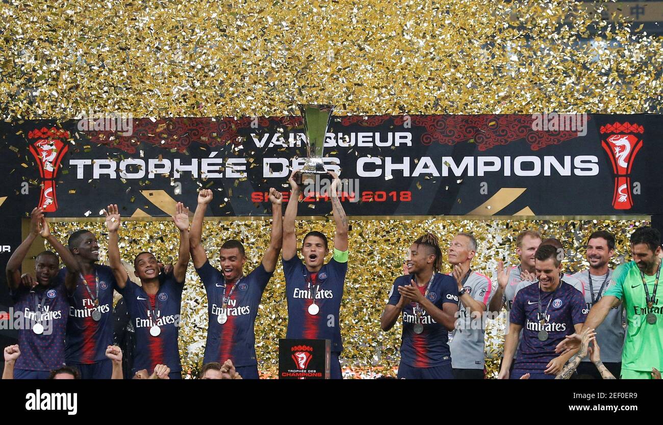 Soccer Football - French Super Cup Trophee des Champions - Paris St Germain v AS Monaco - Shenzhen Universiade Sports Centre, Shenzhen, China - August 4, 2018   Paris St Germain's Thiago Silva celebrates with the trophy and team mates after winning the French Super Cup   REUTERS/Bobby Yip Stock Photo