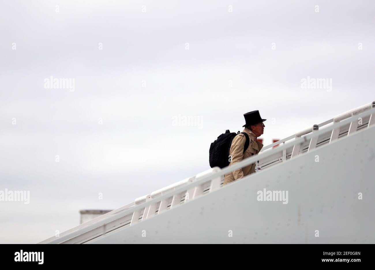 Horse Racing - Derby Festival - Epsom Downs Racecourse, Epsom, Britain - July 4, 2020   British horse racing journalist, Brough Scott sporting a top hat as he arrives at Epsom Racecourse, as racing resumed behind closed doors after the outbreak of the coronavirus disease (COVID-19)   David Davies/Pool via REUTERS Stock Photo