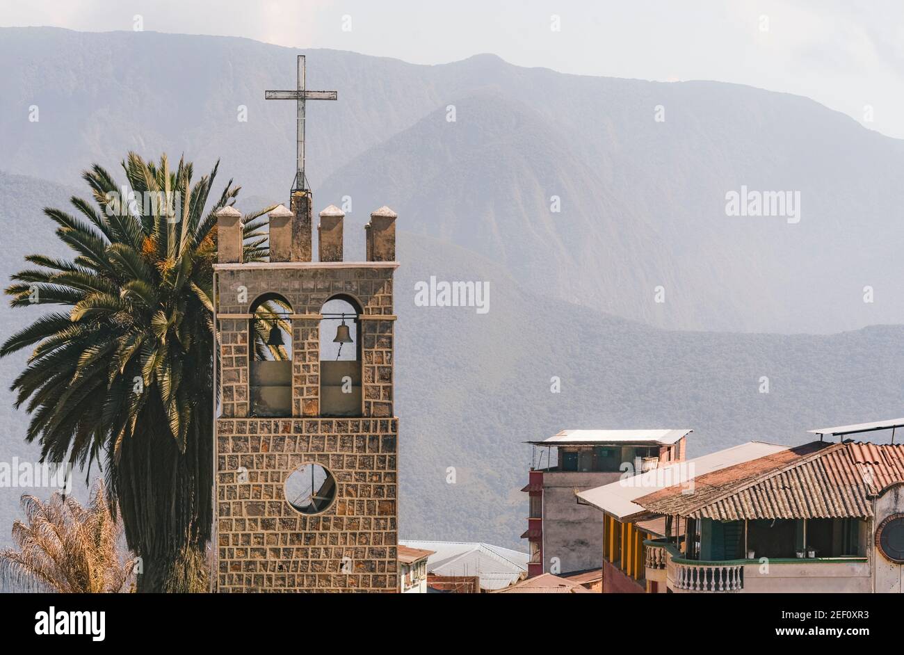 Church tower with palms and mountains in the background, in the downtown of Coroico, Bolivia. This tower is part o Stock Photo
