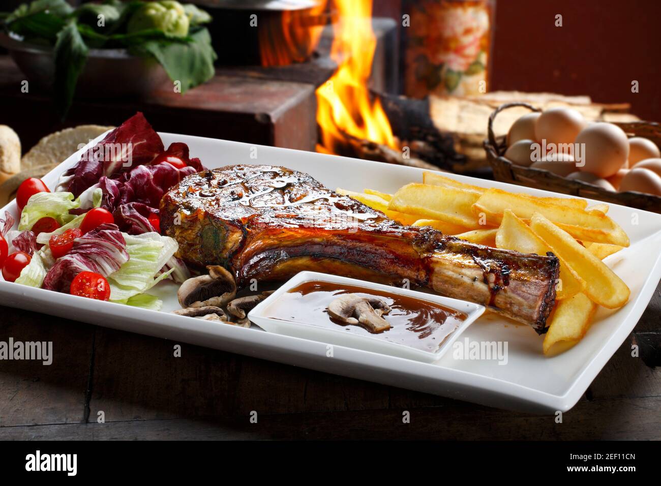 Prime rib with fries and salad Stock Photo - Alamy