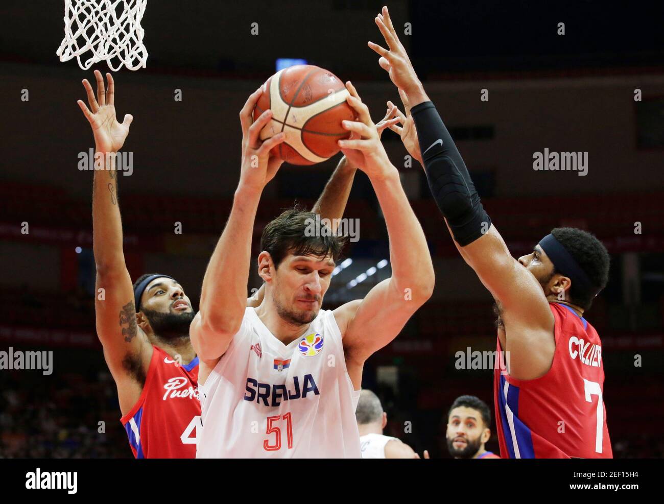 Basketball - FIBA World Cup - Second Round - Group J - Serbia v Puerto Rico - Wuhan Sports Centre, Wuhan, China - September 6, 2019  Serbia's Boban Marjanovic in action with Puerto Rico's Devon Collier REUTERS/Jason Lee Stock Photo