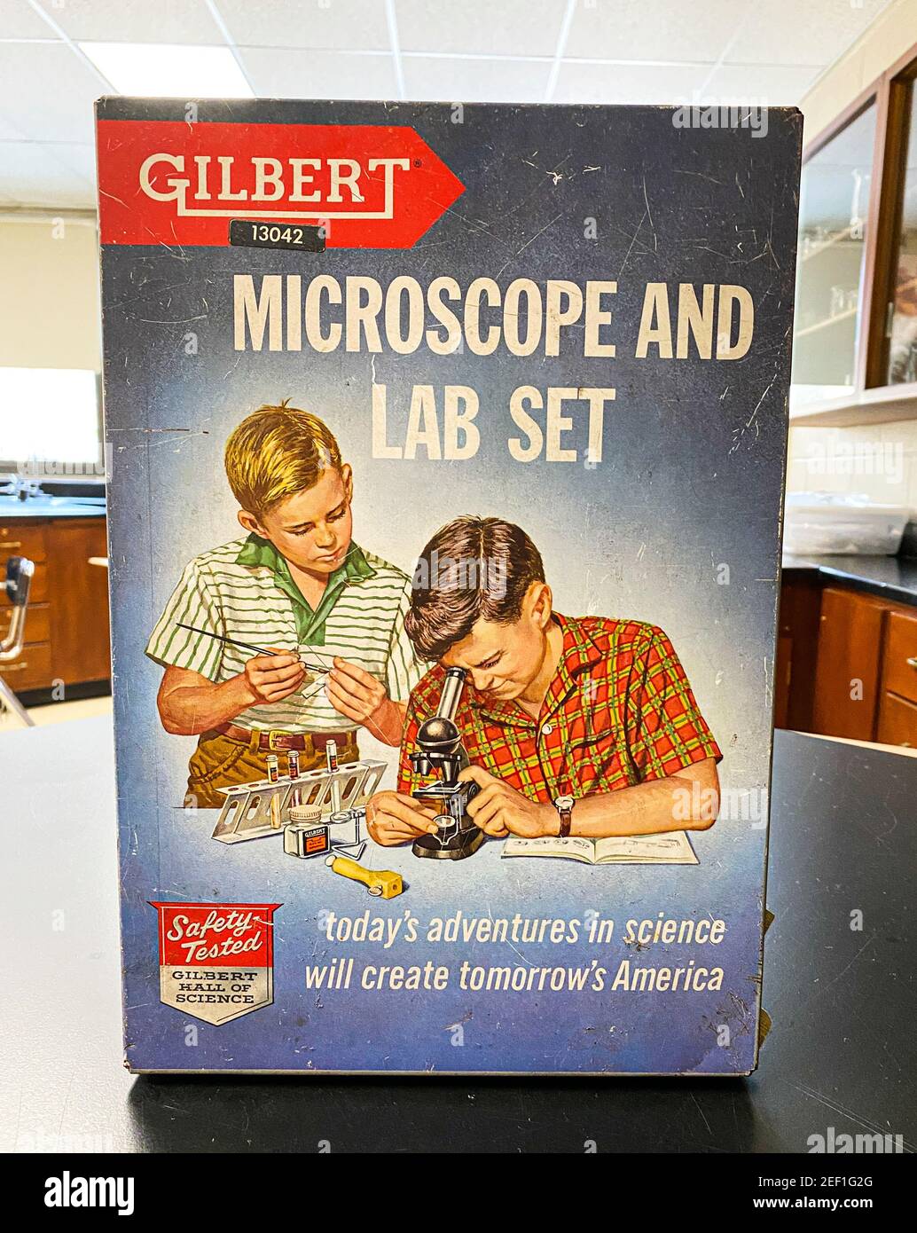 West Islip, New York, USA - 5 February 2021: A vintage Gilbert Microscope and Lab set in a high school science lab room. Stock Photo