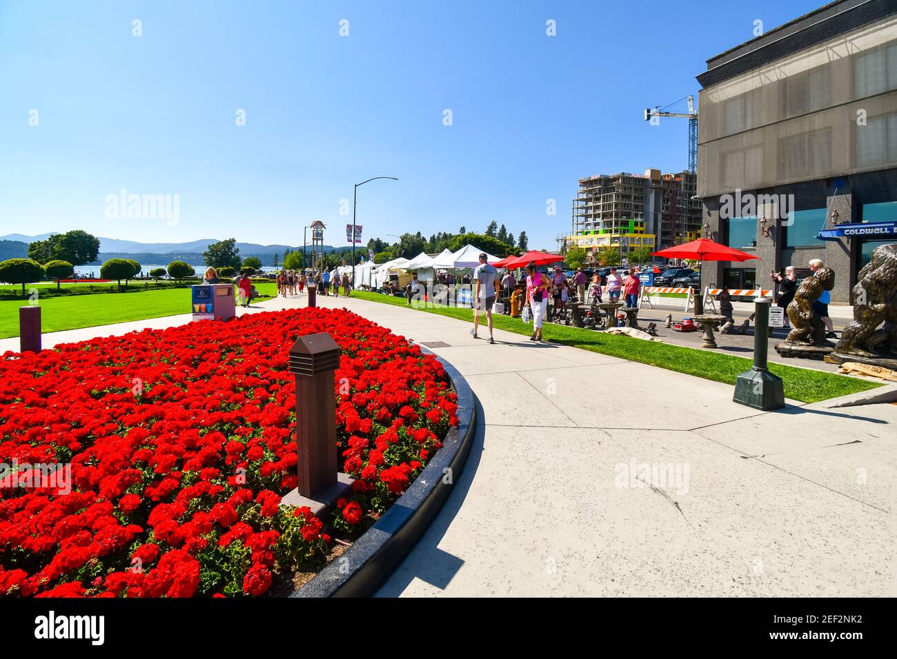 Tourists and locals enjoy the annual Art on the Green festival in the lakefront town of Coeur d'Alene, Idaho Stock Photo