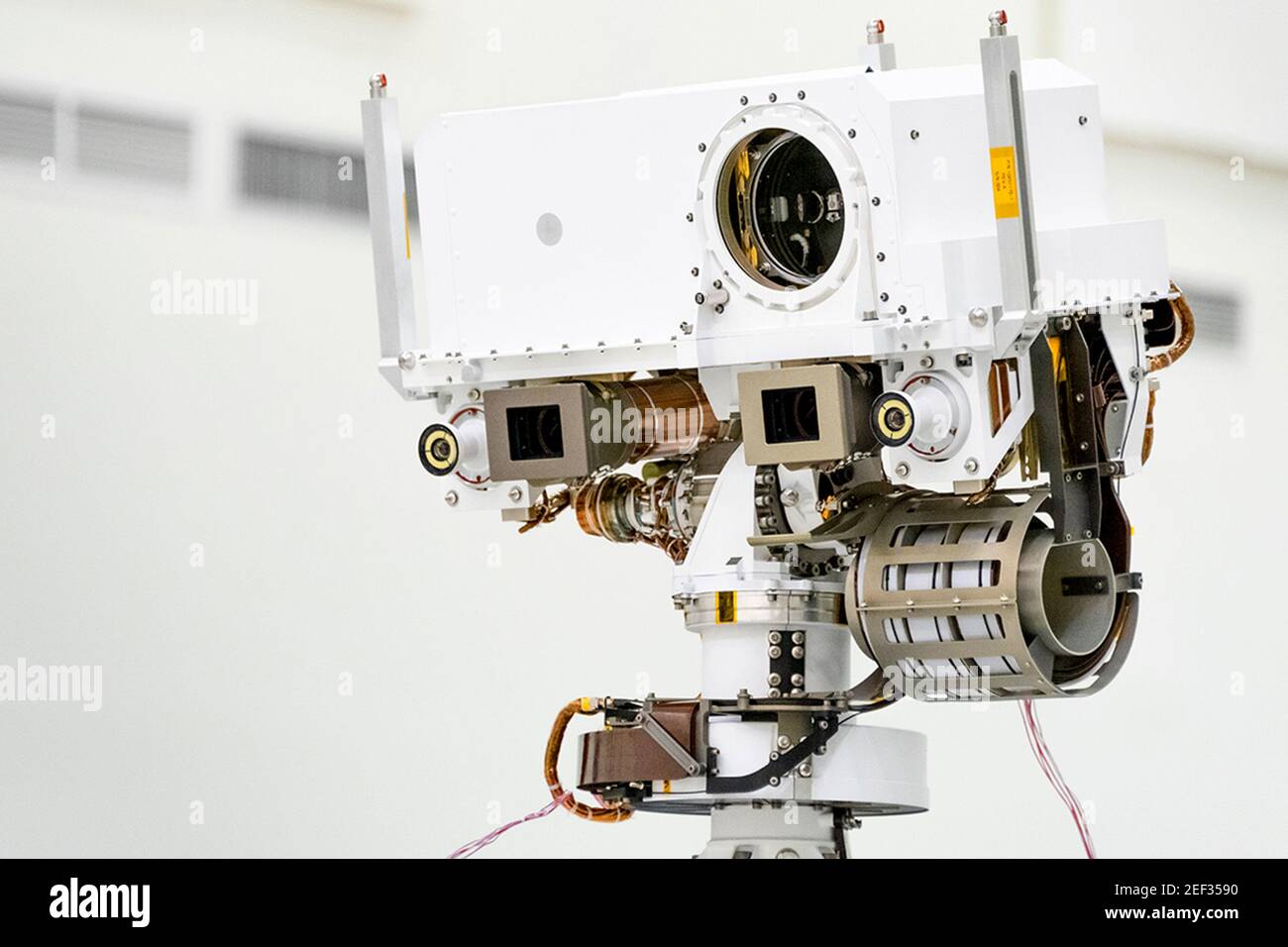 NASA. 16th February, 2021. This image, taken in the Spacecraft Assembly Facility's High Bay 1 at the Jet Propulsion Laboratory in Pasadena, California, on July 23, 2019, shows a close-up of the head of Mars 2020's remote sensing mast. The masthead contains the SuperCam instrument (its lens is in the large circular opening). In the gray boxes beneath the masthead are the two Mastcam-Z imagers. On the exterior sides of those imagers are the rover's two navigation cameras. Credit: UPI/Alamy Live News Stock Photo