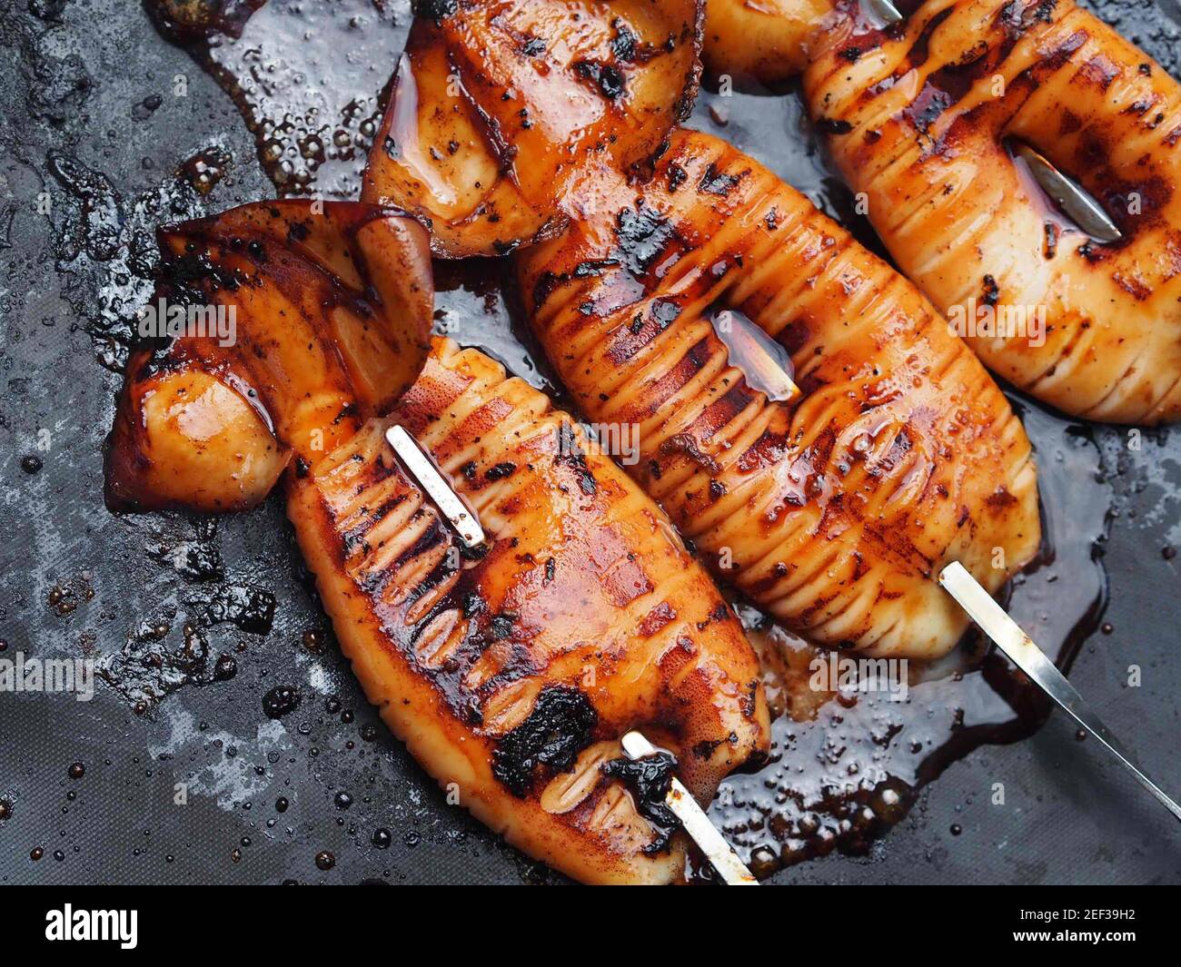 Grilled Whole Squid Stock Photo - Alamy