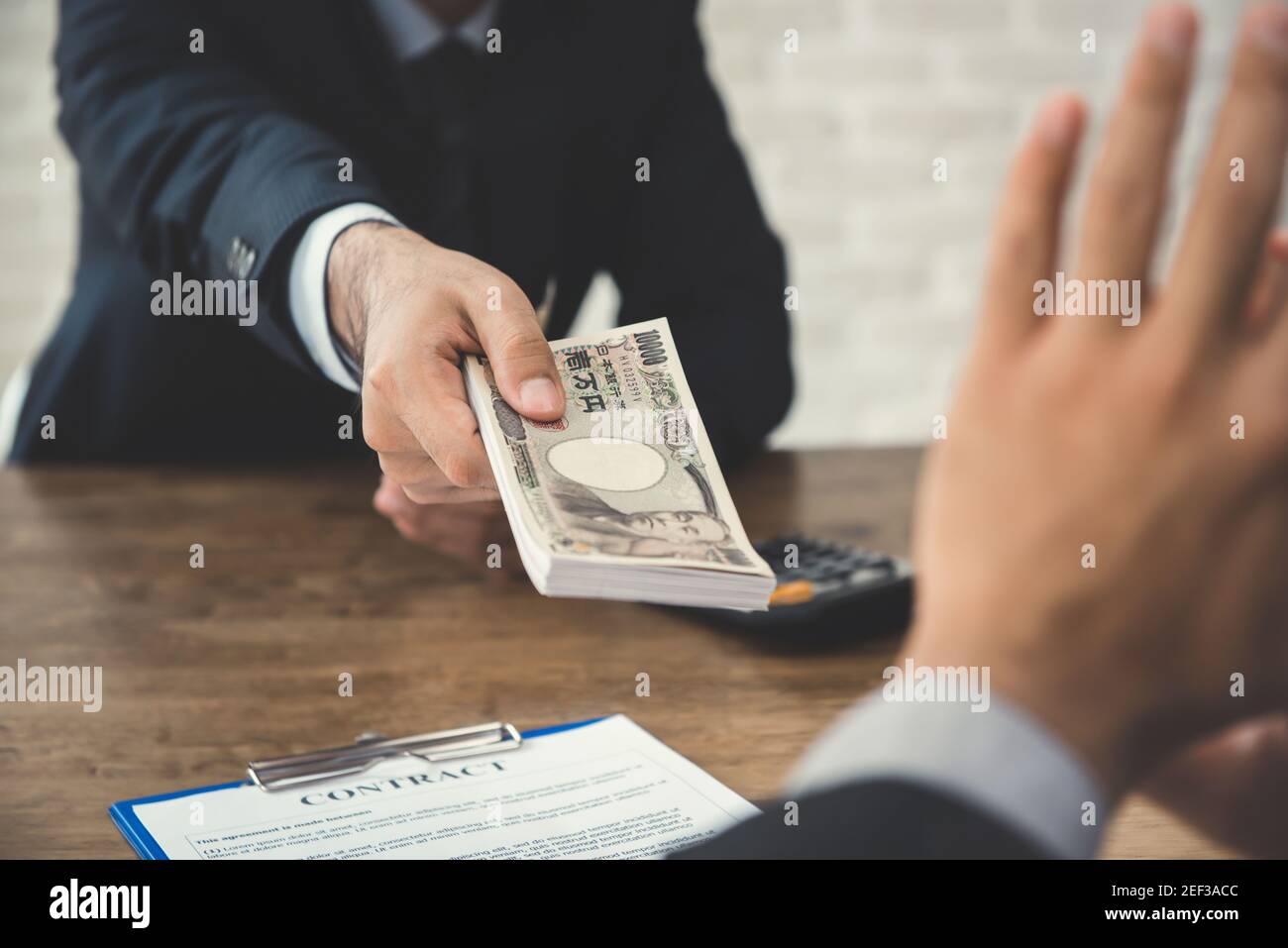 Businessman refusing money, Japanese yen bills - anti bribery and corruption concepts Stock Photo