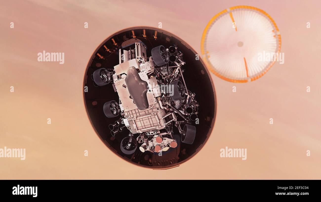 NASA. 16th February, 2021. In this illustration, NASA's Perseverance rover gets its first look at the Martian surface below, after dropping its heat shield just under six minutes after entry into the Mars atmosphere. Hundreds of critical events must execute perfectly and exactly on time for the rover to land safely on February 18, 2021. Entry, Descent, and Landing, or 'EDL,' begins when the spacecraft reaches the top of the Martian atmosphere, traveling nearly 12,500 mph (20,000 kph). EDL ends about seven minutes after atmospheric entry, with Perseverance stationery on the Martian surface. Cre Stock Photo