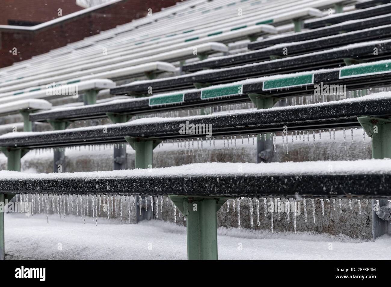 Bleachers of Peden Stadium at Ohio University are covered in snow.Snowstorm Uri swept across the United States from February 12th to the 16th covering the United States in snow and Ice. Uri begun in the Pacific Northwest, and headed all the way to the southeast of US. The storm has claimed many lives due to car accidents and low temperatures. In Athens County Ohio the storm began on Monday morning February 15, 2021 and has continued into Tuesday 16, 2021. Currently Athens County is under a level two snow emergency. Stock Photo