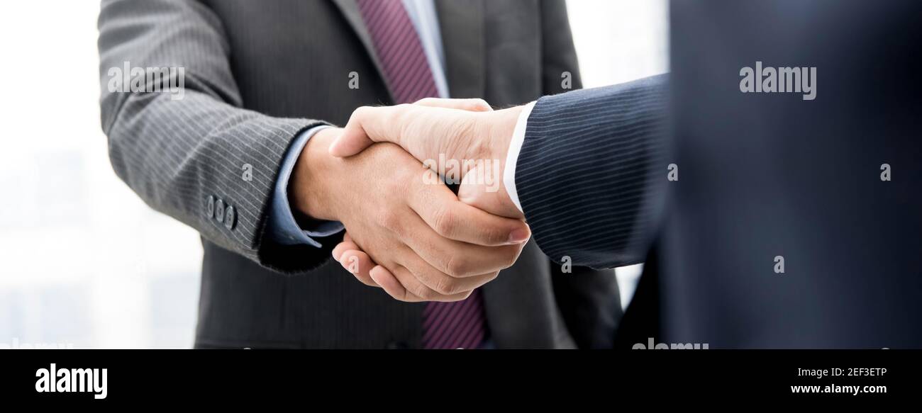 Businessmen making handshake,  panoramic  web banner Stock Photo