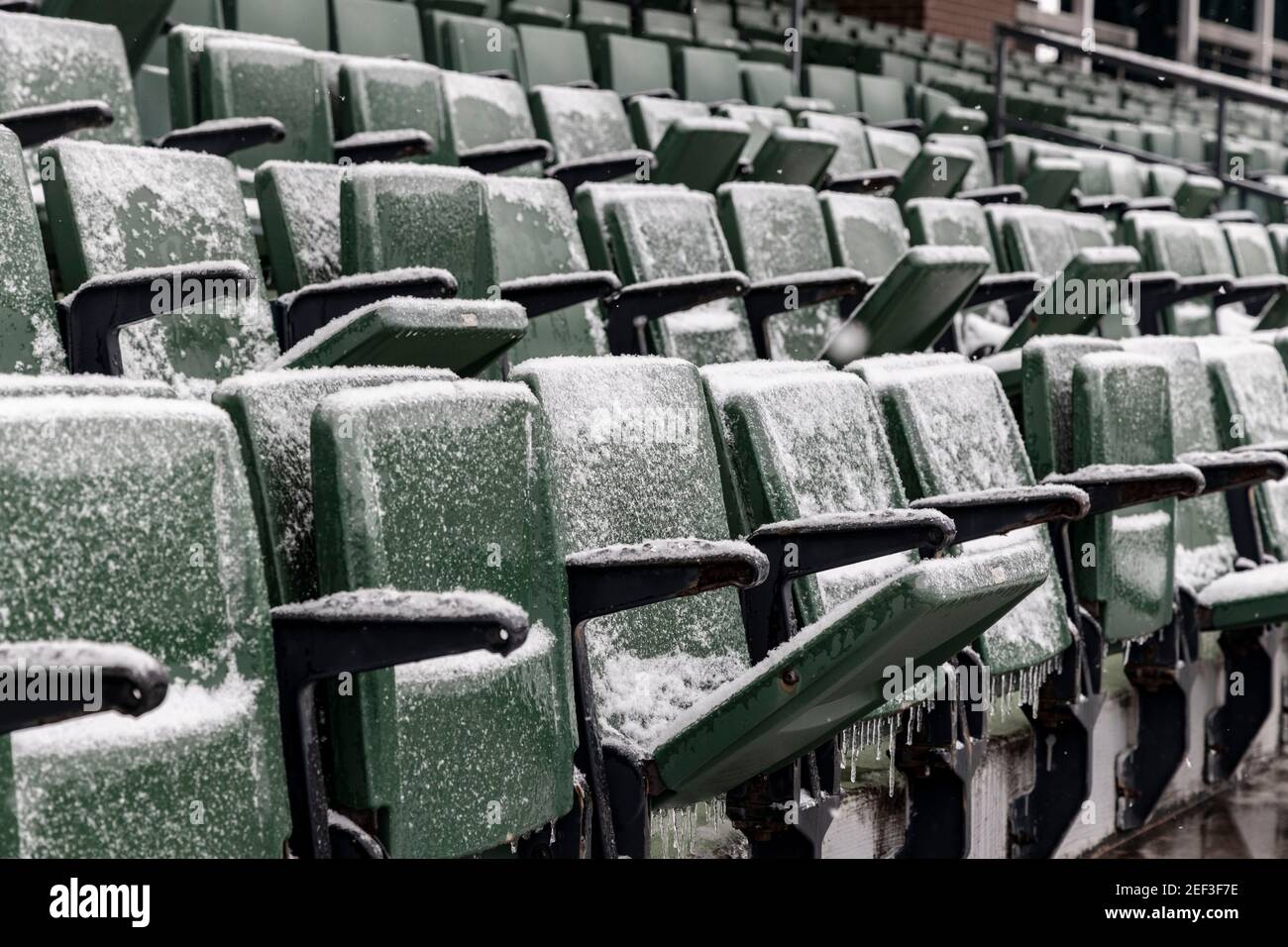 Seats in Peden Stadium are covered with snow.Snowstorm Uri swept across the United States from February 12th to the 16th covering the United States in snow and Ice. Uri begun in the Pacific Northwest, and headed all the way to the southeast of US. The storm has claimed many lives due to car accidents and low temperatures. In Athens County Ohio the storm began on Monday morning February 15, 2021 and has continued into Tuesday 16, 2021. Currently Athens County is under a level two snow emergency. Stock Photo