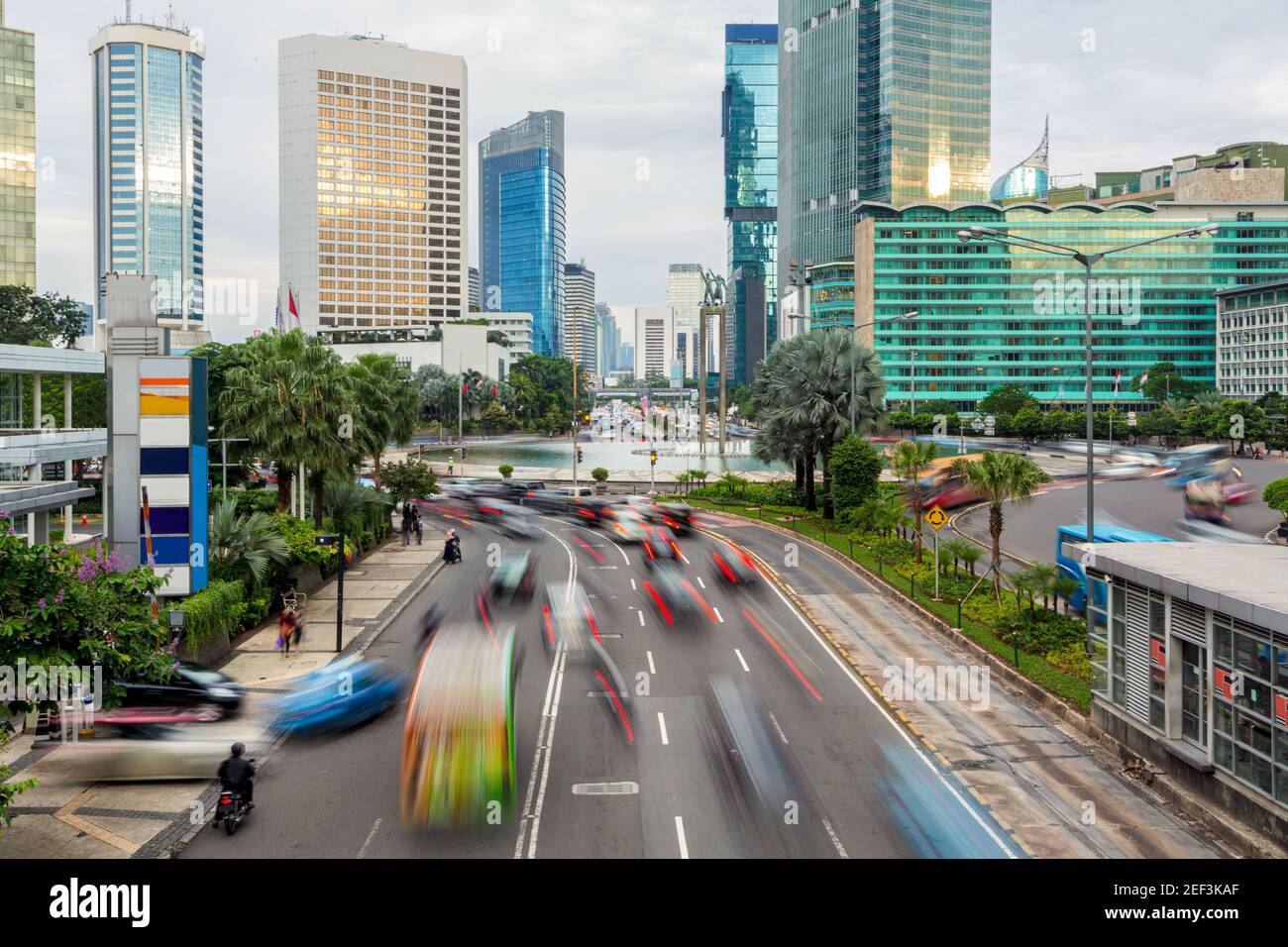 Traffic captured with blured motion drive around the Plaza Indonesia roundabout in Jakarta business district, Indonesia capital city Stock Photo