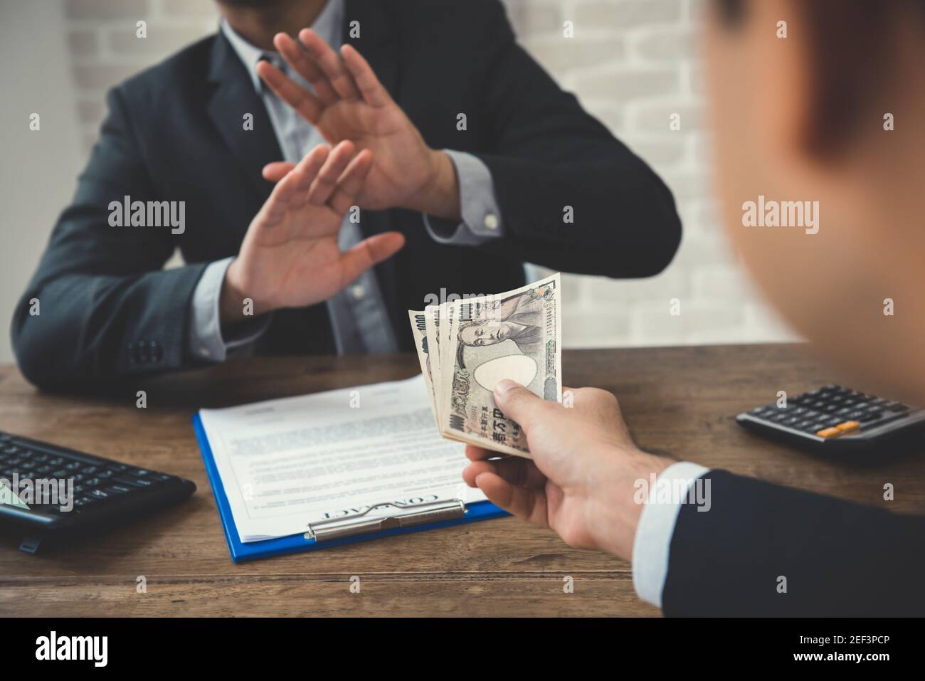 Businessman refusing money - anti bribery and corruption concepts Stock Photo