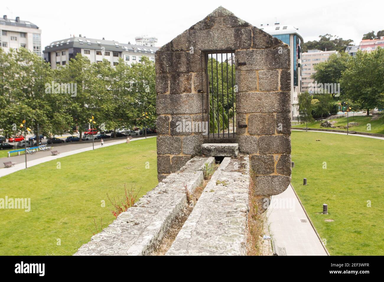 Old stone aqueduct that is part of the Walk of the bridges park in A Coruña, Spain Stock Photo