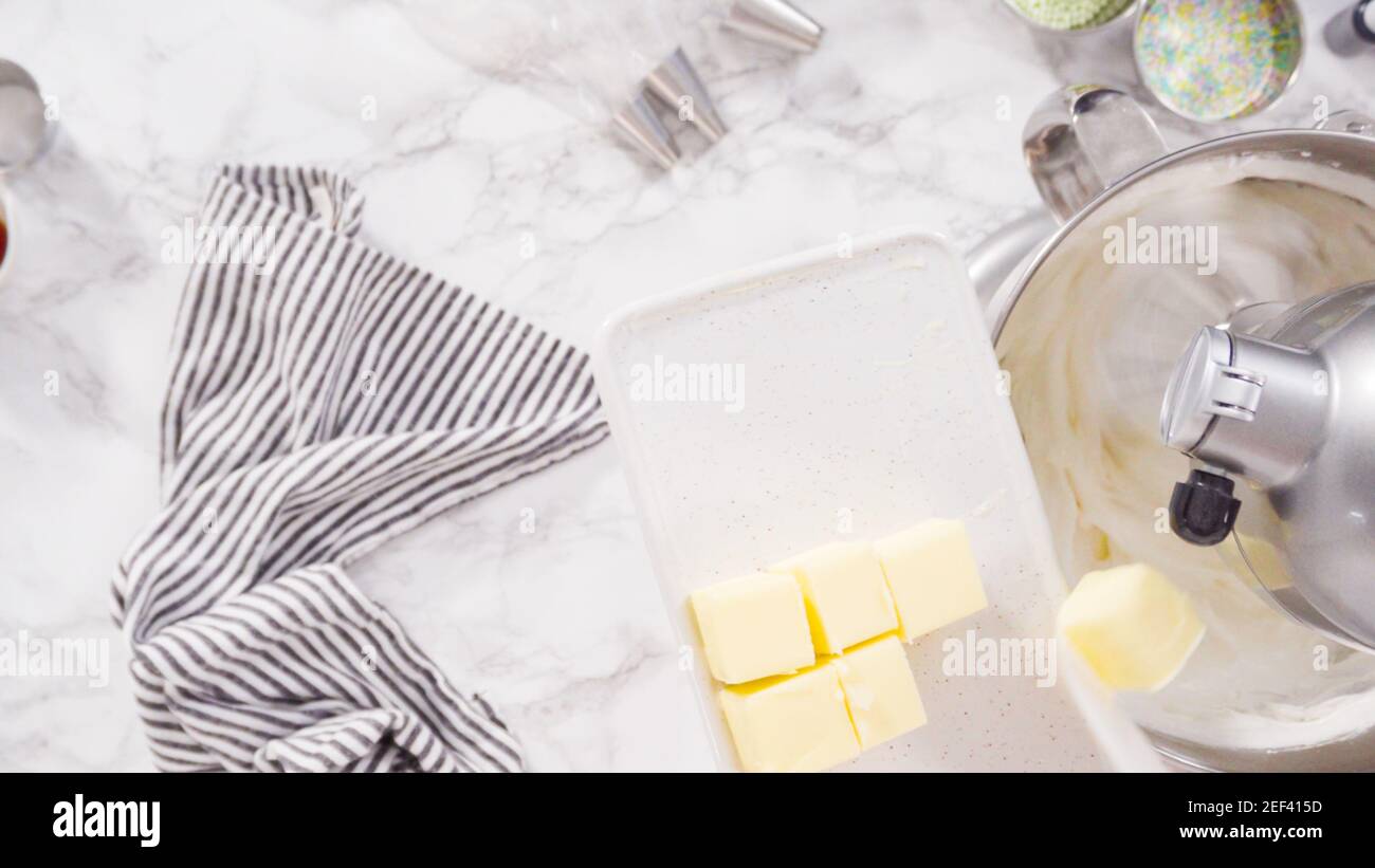 Preparing Italian buttercream frosting in standing kitchen mixer Stock