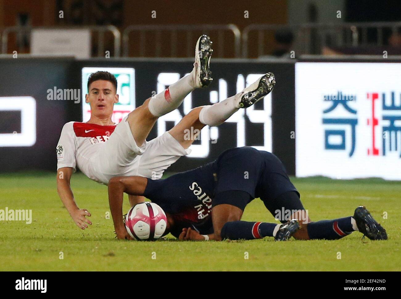 Soccer Football - French Super Cup Trophee des Champions - Paris St Germain v AS Monaco - Shenzhen Universiade Sports Centre, Shenzhen, China - August 4, 2018   Paris St Germain's Christopher Nkunku in action with AS Monaco's Julien Serrano   REUTERS/Bobby Yip Stock Photo