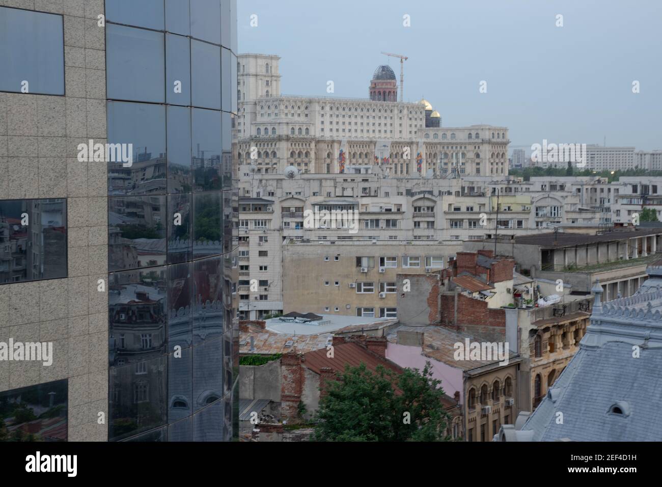 Overview of a variety of contrasting architectural styles of buildings in Bucharest, Romania, cityscape dominated by government building. Stock Photo