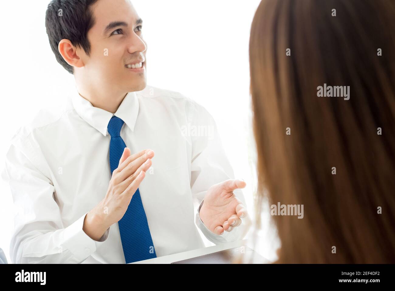 Smiling Businessman giving an applause in the meeting Stock Photo