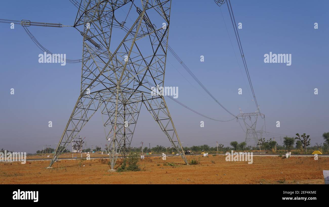 High Tension electrical lines passing through rural region of Kerala, South  India Stock Photo - Alamy