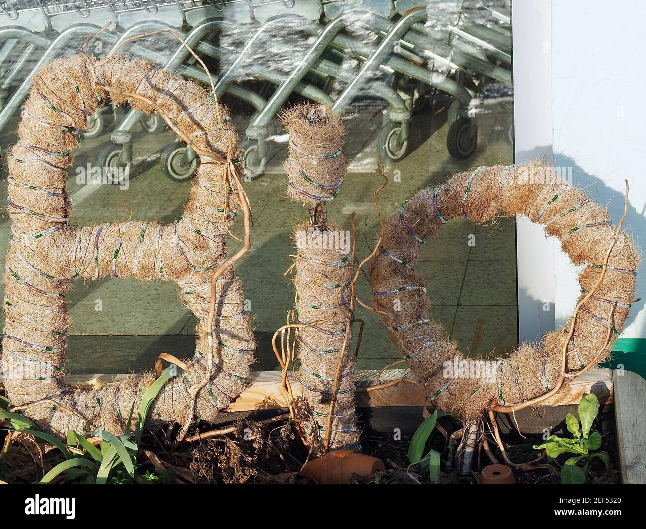 big letters show a reference to Bio food in front of a store Stock Photo