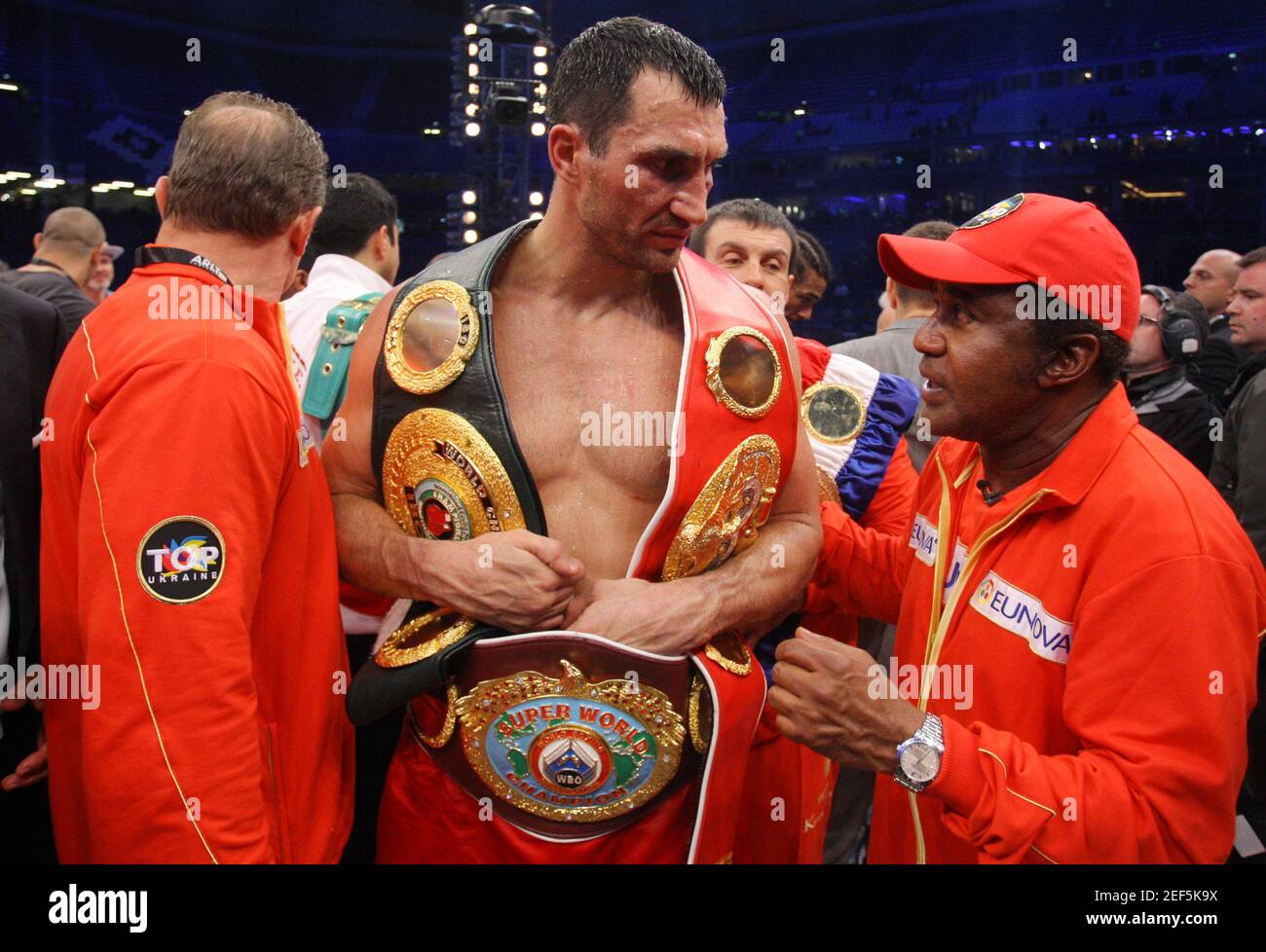 Boxing - Wladimir Klitschko v David Haye - IBF, WBO, IBO & WBA Heavyweight  Title's - The Imtech Arena, Hamburg, Germany - 2/7/11 Wladimir Klitschko  celebrates victory with his belts and trainer