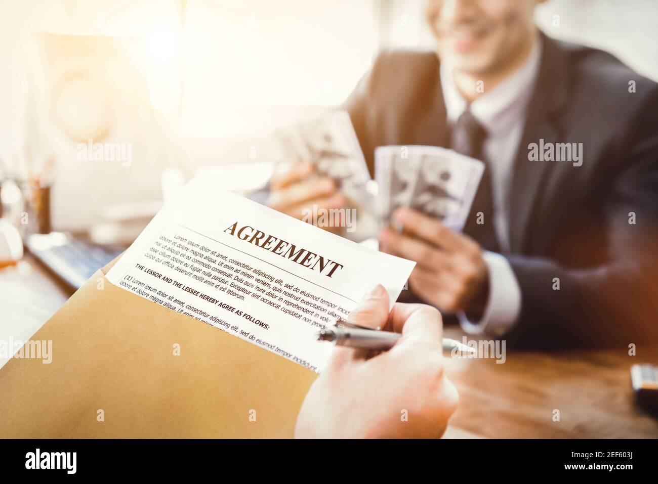Business partner making an agreement - loan, bribery and corruption concepts Stock Photo