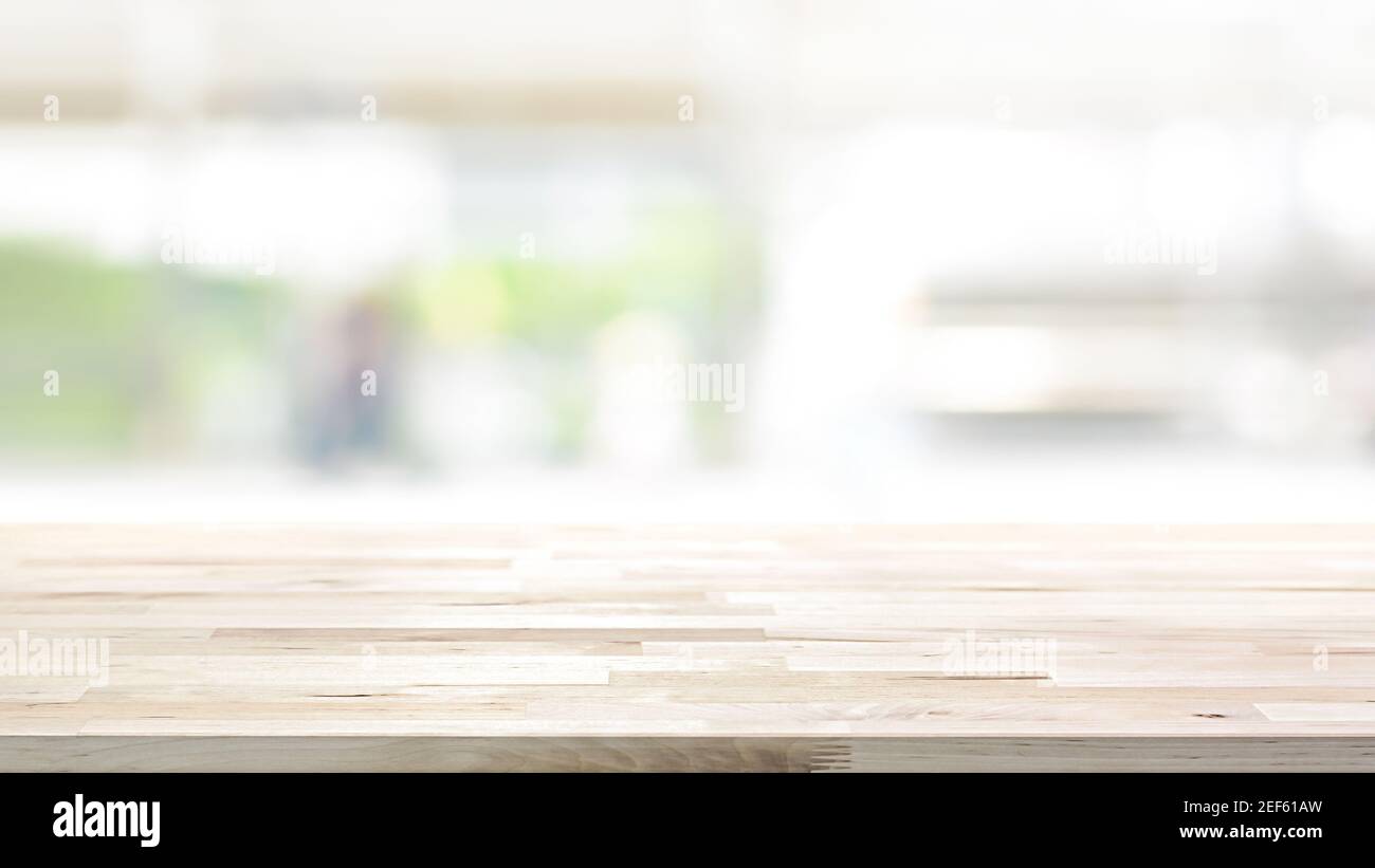 Wood table top on blur kitchen window background, 16:9 proportion - can be used for display or montage your products (or foods) Stock Photo