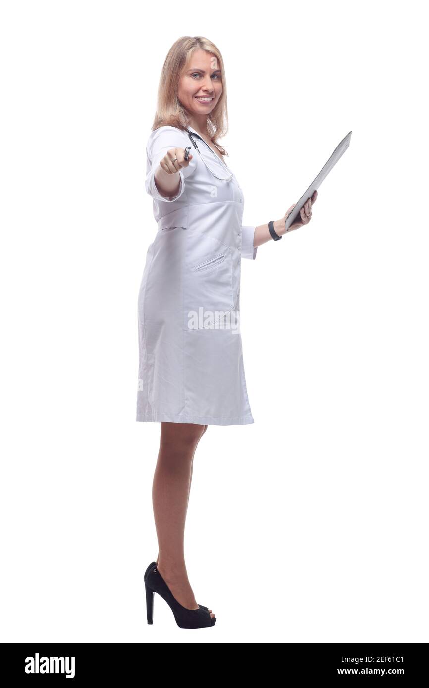 smiling doctor making notes in the clipboard . isolated on a white background. Stock Photo