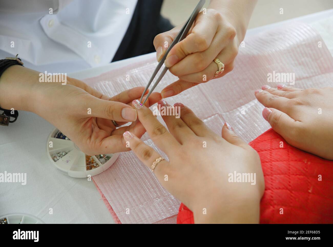 Manicure. Beautiful well-groomed hands and fingernails for woman. Taking care of your appearance and healthy lifestyle. Stock Photo