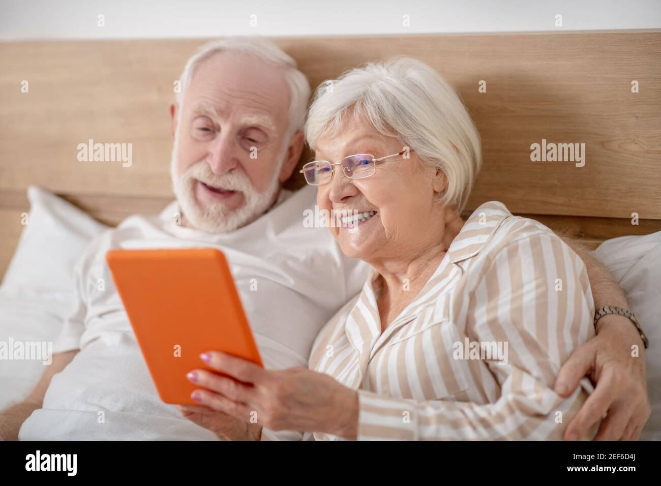 Married couple lying in bed hi-res stock photography and images - Alamy