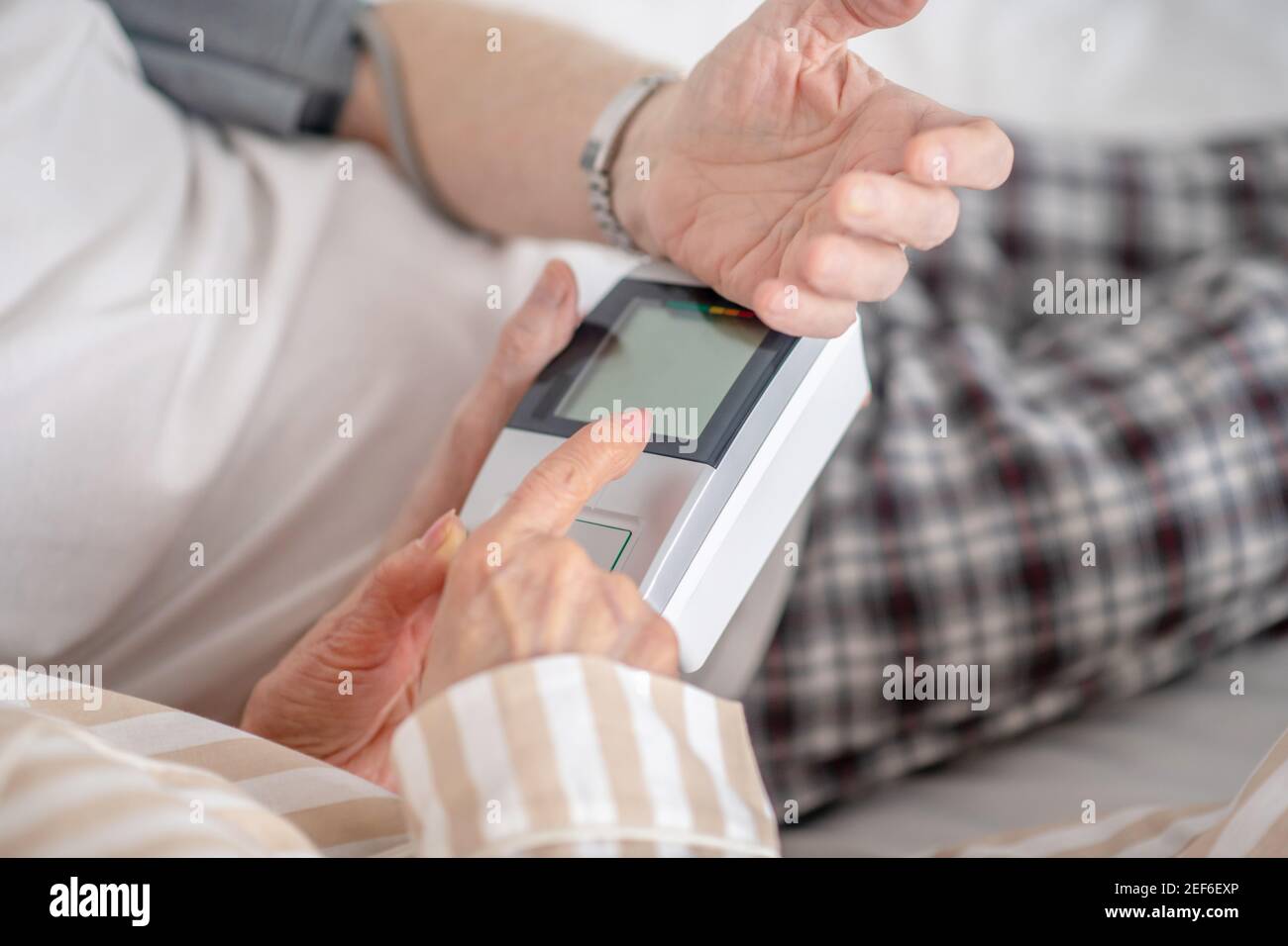 Close up picture of human hands holding tonometer Stock Photo - Alamy
