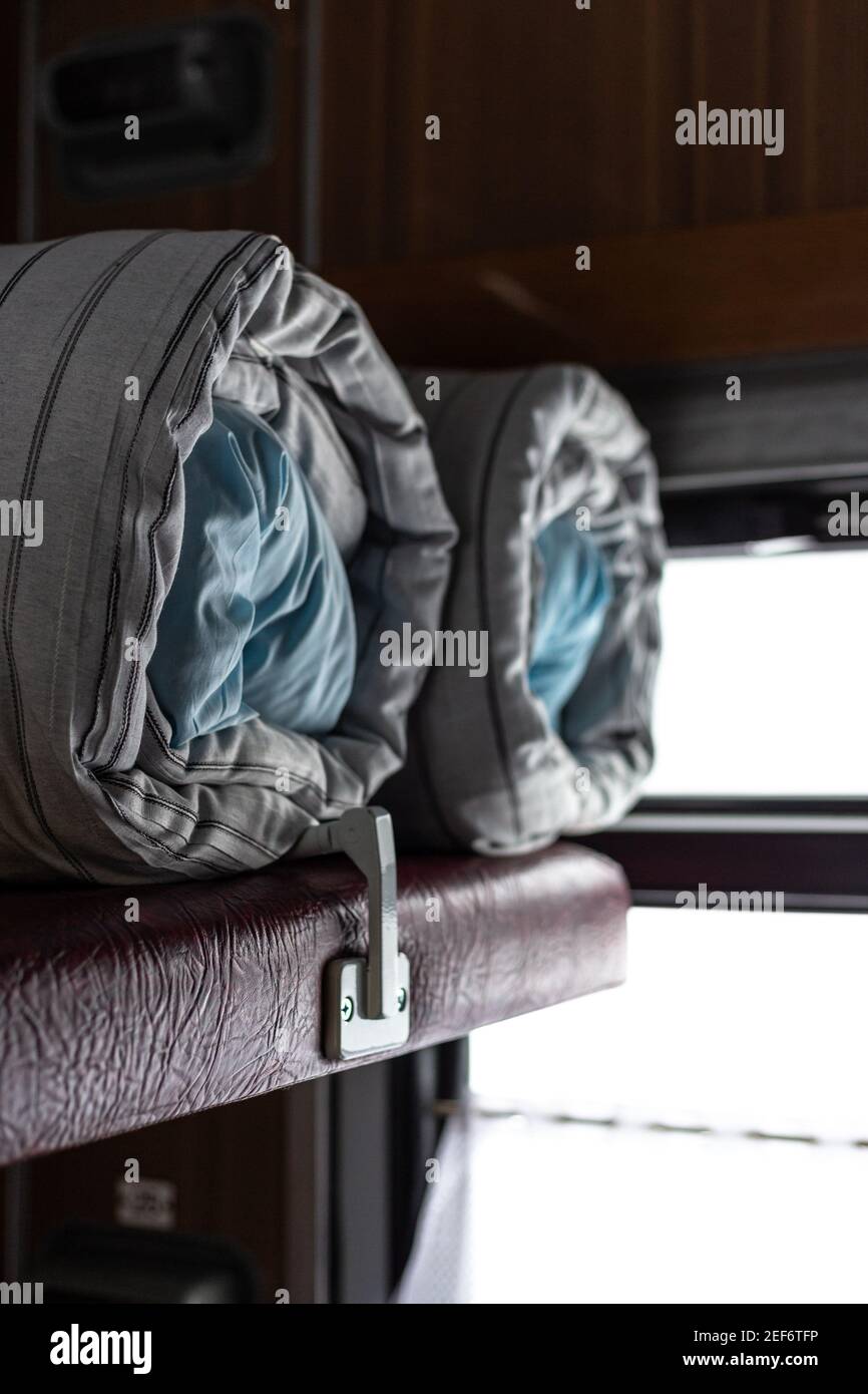 Mattress and pillow folded in the train carriage Stock Photo Alamy