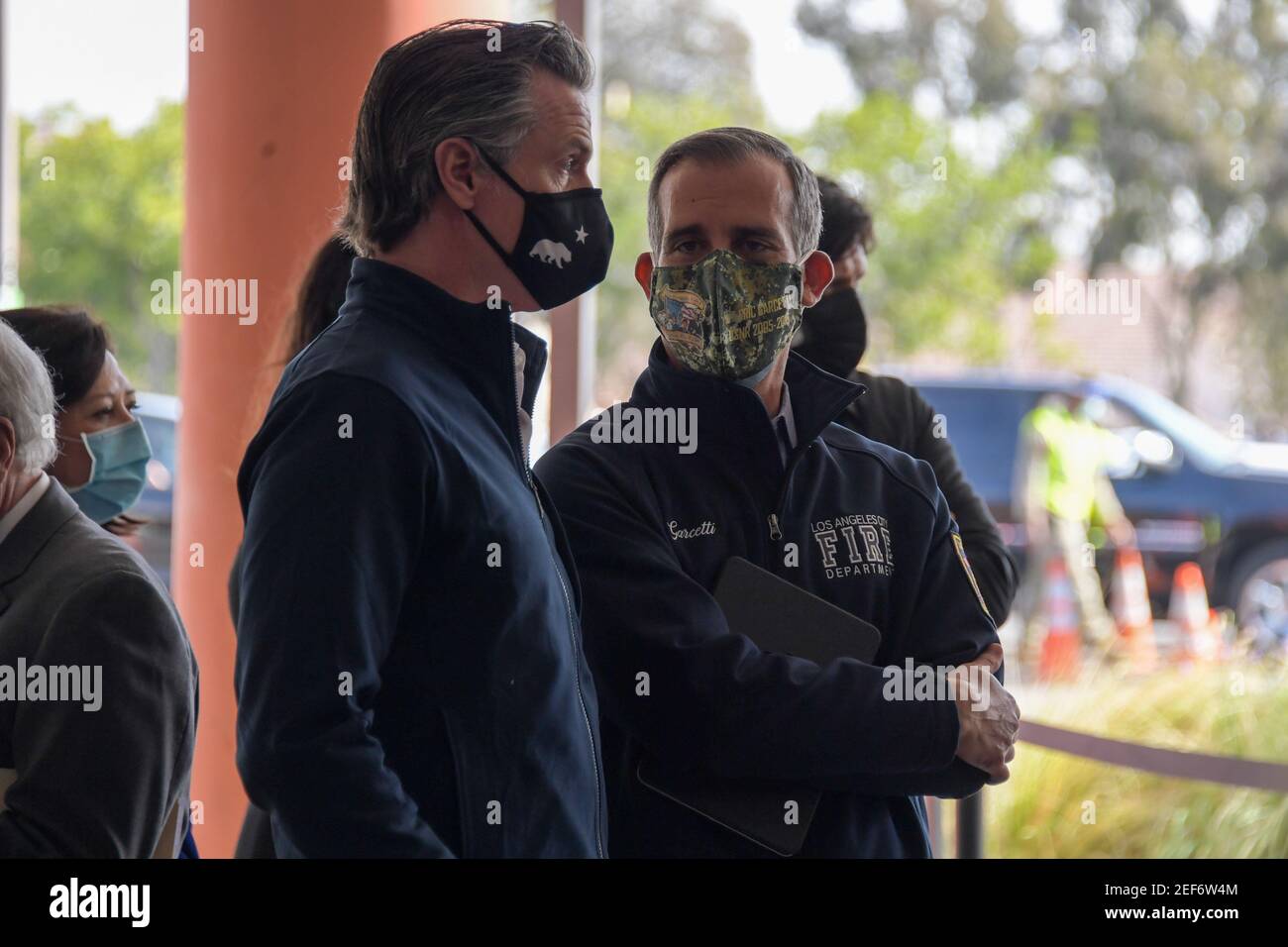 California Gov. Gavin Newsom, left, talks to Los Angeles Mayor Eric Garcetti during a press conference relating to the opening of a state and federal Stock Photo