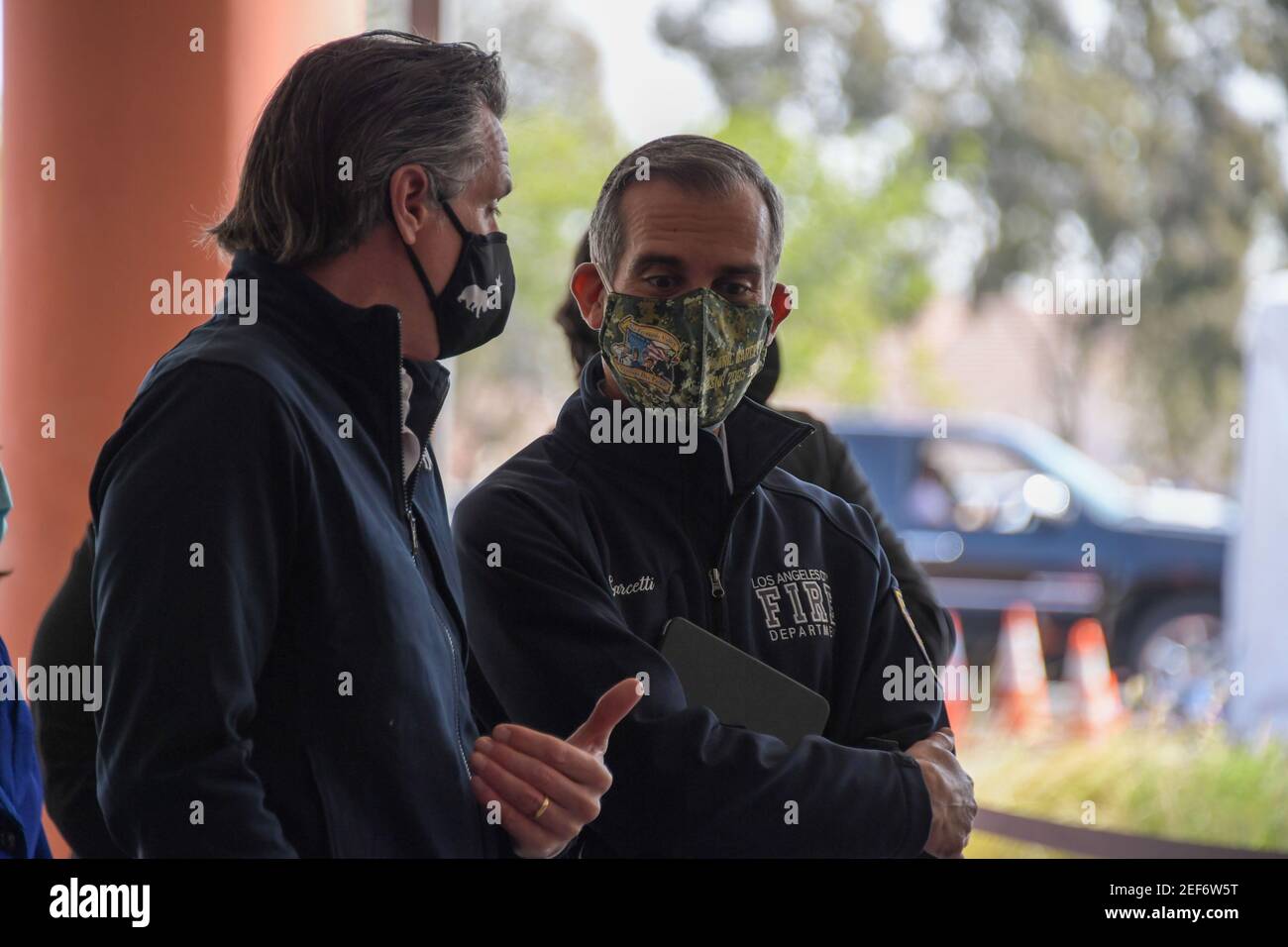 California Gov. Gavin Newsom, left, talks to Los Angeles Mayor Eric Garcetti during a press conference relating to the opening of a state and federal Stock Photo