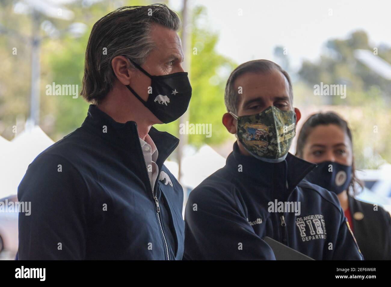 California Gov. Gavin Newsom, left, talks to Los Angeles Mayor Eric Garcetti during a press conference relating to the opening of a state and federal Stock Photo