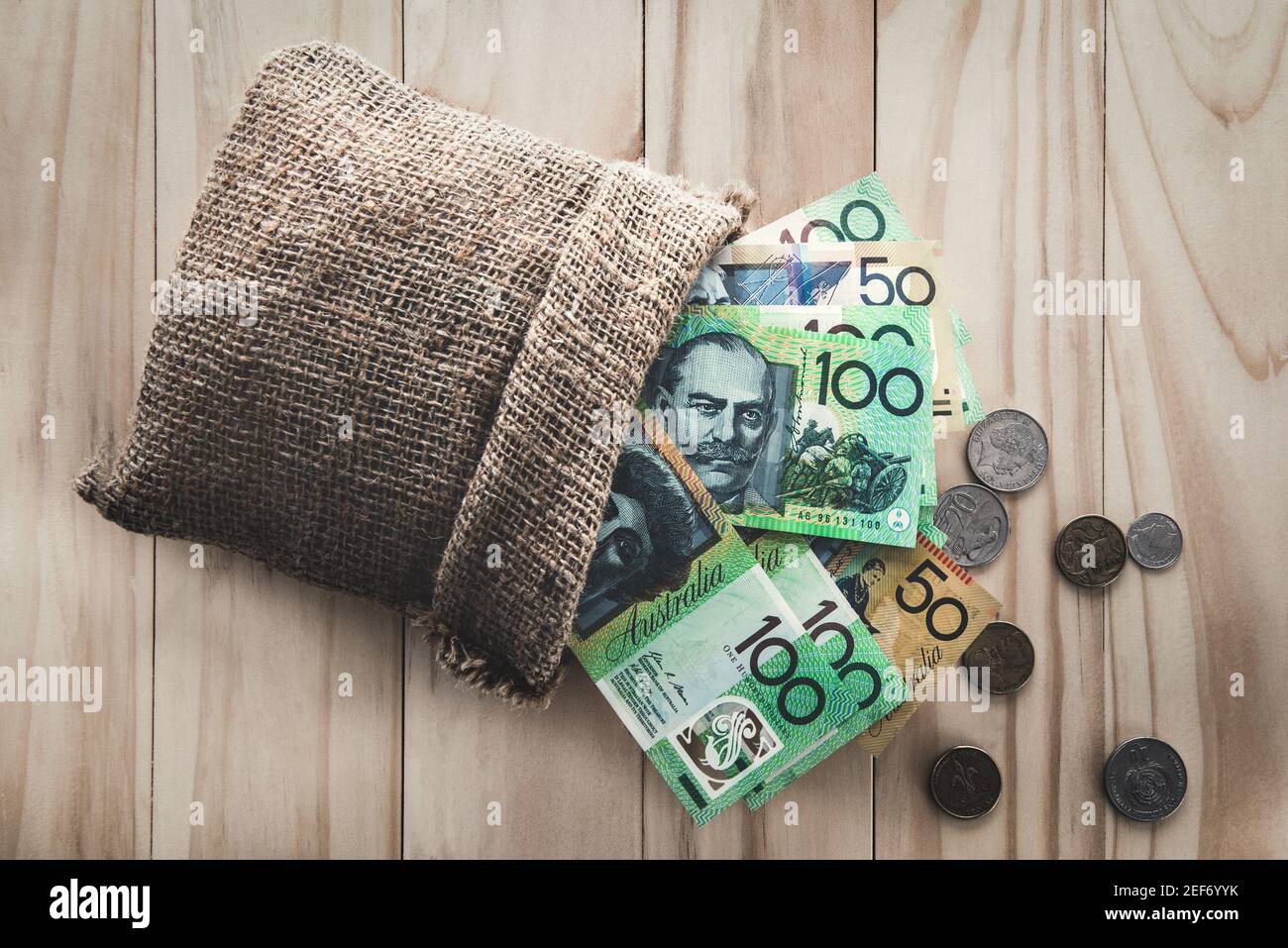 Money, Australian dollars (AUD), spilled out from a bag Stock Photo